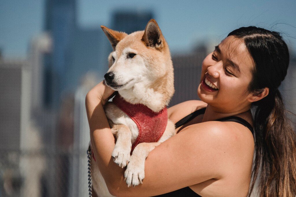 Woman outdoors with dog representing mind wellness
